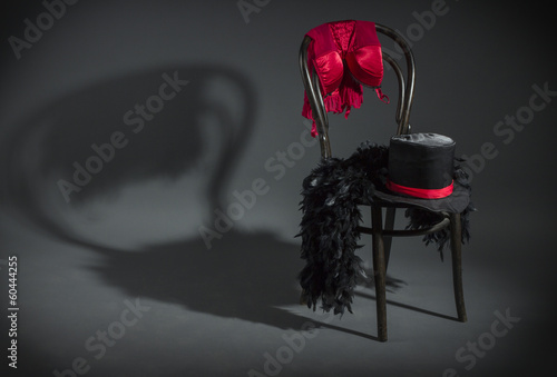 On retro chair is a cabaret dancer clothing.