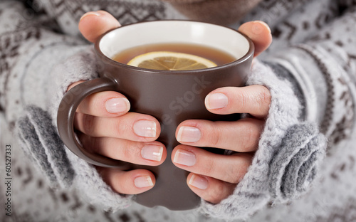 Woman hands with hot drink