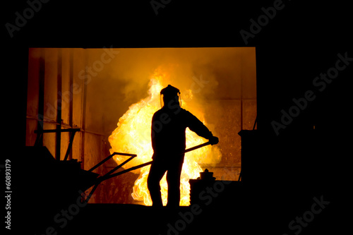 Hard work in a foundry, melting iron