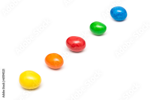 Colorful Row Of Coated Chocolate Candy Close Up Isolated