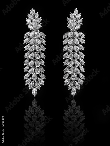Diamond Earrings on a black reflective background