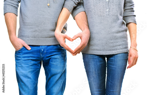 Valentine couple in love showing heart with their fingers