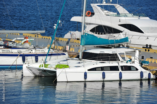 Trimaran motor yacht over harbor pier, Odessa, Ukraine