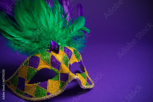 Mardi Gras or Carnivale mask on a purple background