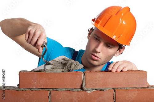 Concentrated bricklayer putting