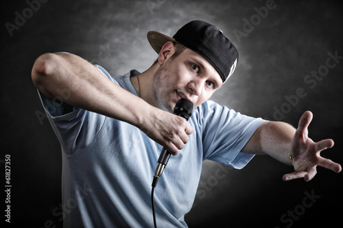 Rap singer man with microphone cool hand gesture