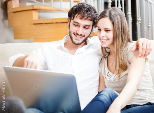 Couple using a laptop