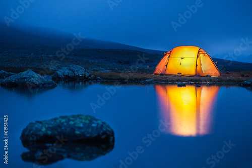 Illuminated tent in the blue hour