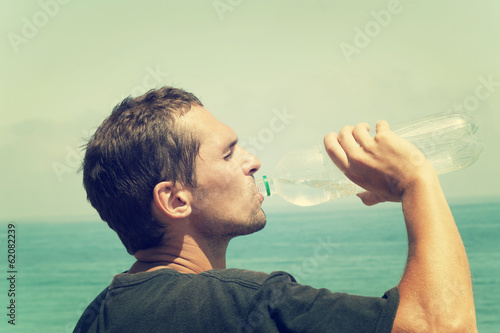 man drinking water