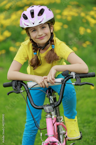 Bike riding - young girl on bike, active child concept