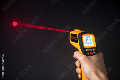 infrared laser thermometer in hand