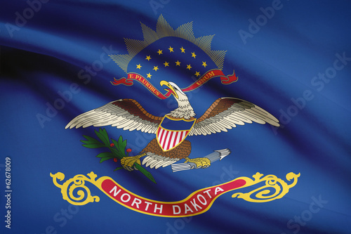 Series of ruffled flags of US states. State of North Dakota.