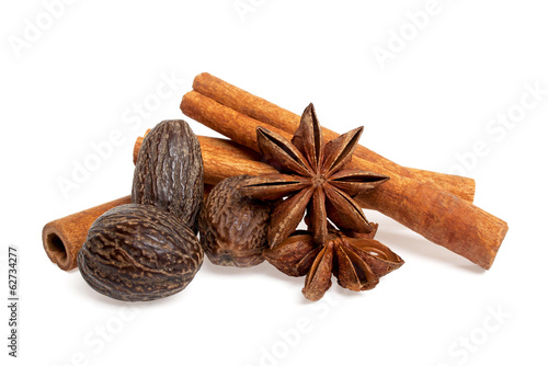 Stars anise, cinnamon sticks and nutmeg isolated on white backgr