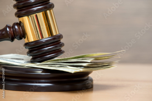 gavel on a money