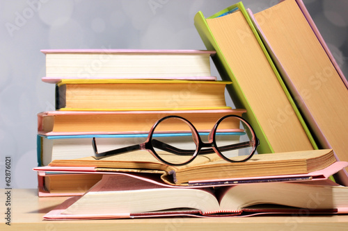 Composition with glasses and books,