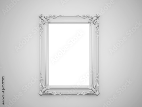 Vintage mirror with silver frame on the wall