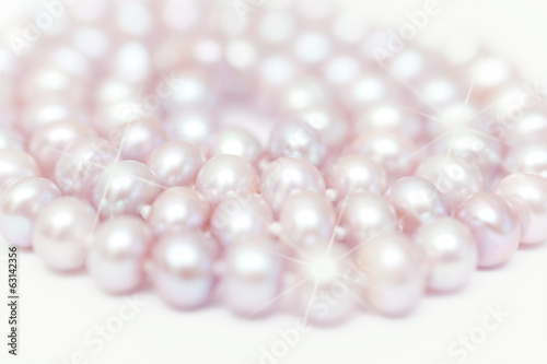 string of pearls delicate pink color, defocused image