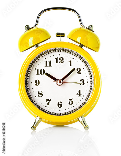 yellow alarm clock isolated on white background