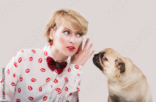 Vintage style woman listening to her dog