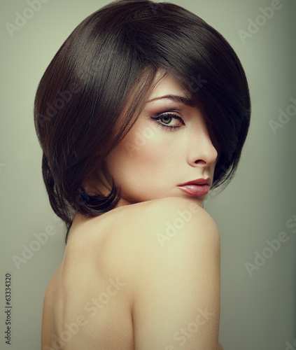 Vogue portrait of alluring woman with short hair style. Closeup