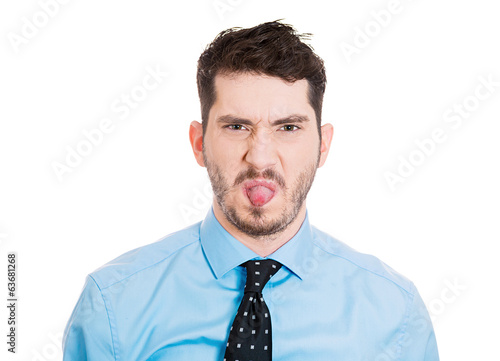 Portrait Childish business man sticking his tongue out