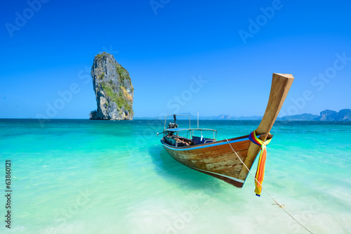 Cliff and boat in the amazing beach in tropical island in Krabi, Phuket, Thailand