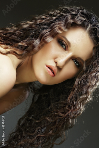 beautiful woman with long curly hairs