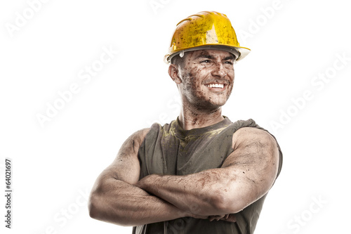 portrait of dirty worker with helmet crossed arms