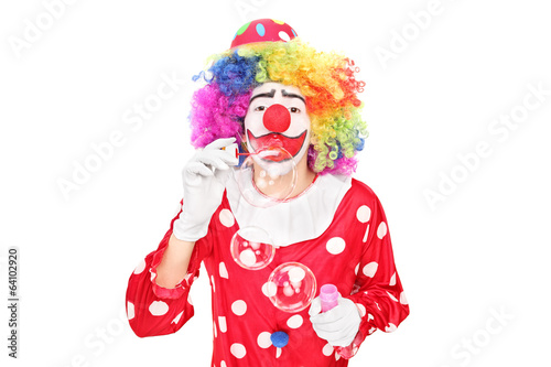 Funny clown blowing bubbles