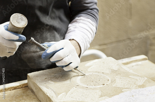 Man carving stone