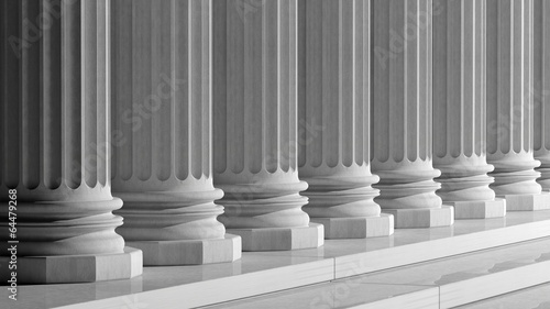 White ancient marble pillars in a row