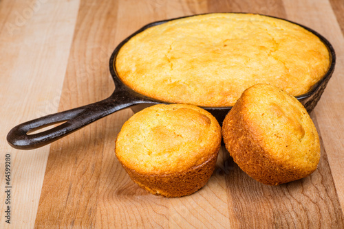 Cornbread muffins and cornbread pone in an iron skillet