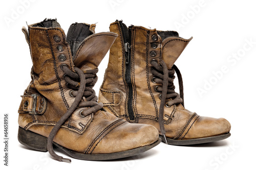 Pair of an old boots isolated on white background.