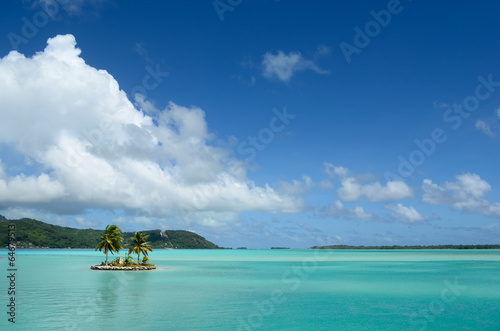 Island in the clear Bora Bora lagoon