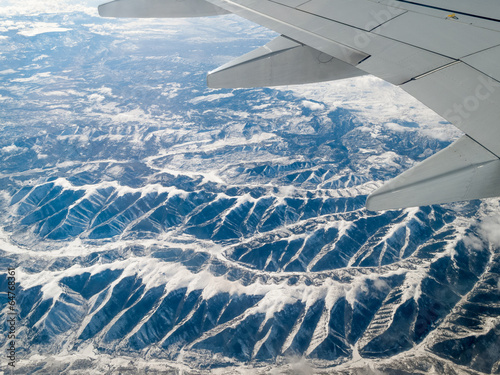 Aerial view of mountain range viewed from airplane, Alberta's Ro