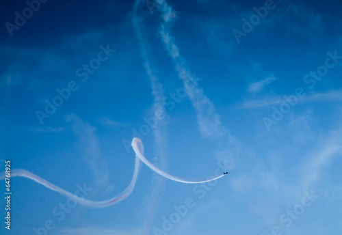 Low angle view of an airplane performing airshow