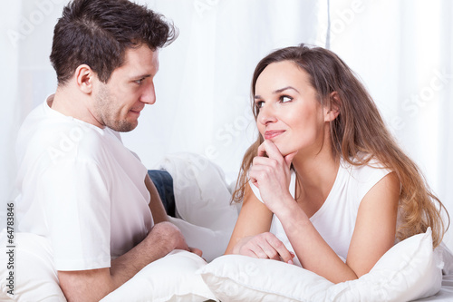 A couple contemplating in bed