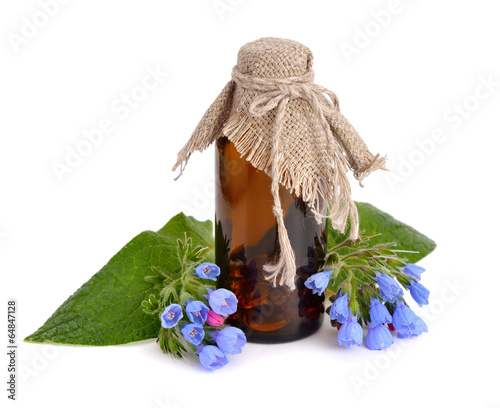 Symphytum (comfrey) with pharmaceutical bottle