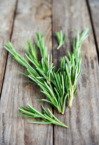 fresh rosemary bunch on an old rustic wooden table