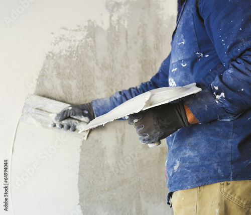 plastering tool plaster marble on plaster rough, selective focus