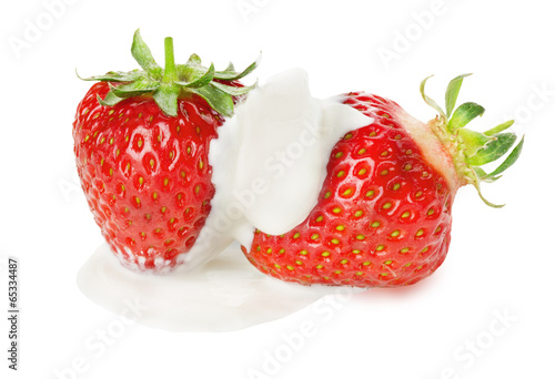 juicy strawberries in cream on the white background