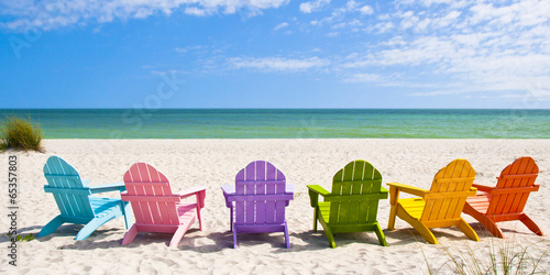 Adirondack Beach Chairs on a Sun Beach in front of a Holiday Vac