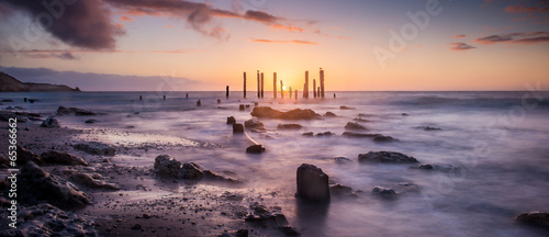 Sunset over jetty remains
