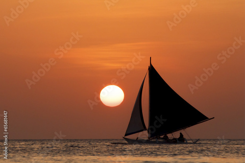 Sunset cruise on traditional island sailboats