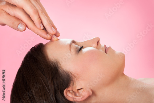 Woman Receiving Head Massage In Spa