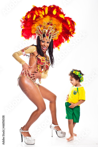 Brazilian child dancing with Samba girl