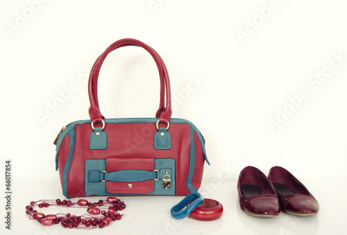 Red and blue purse with matching necklace, bracelets and flats.