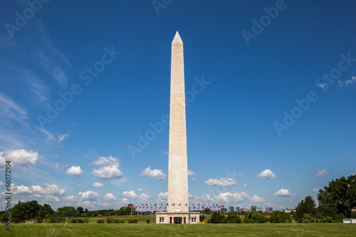 Side view of the Washington monument and the ring of American fl