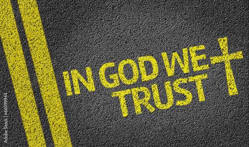 In God We Trust written on the road
