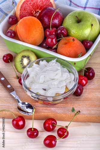 fruit salad with sweet sour cream and different types of fruits